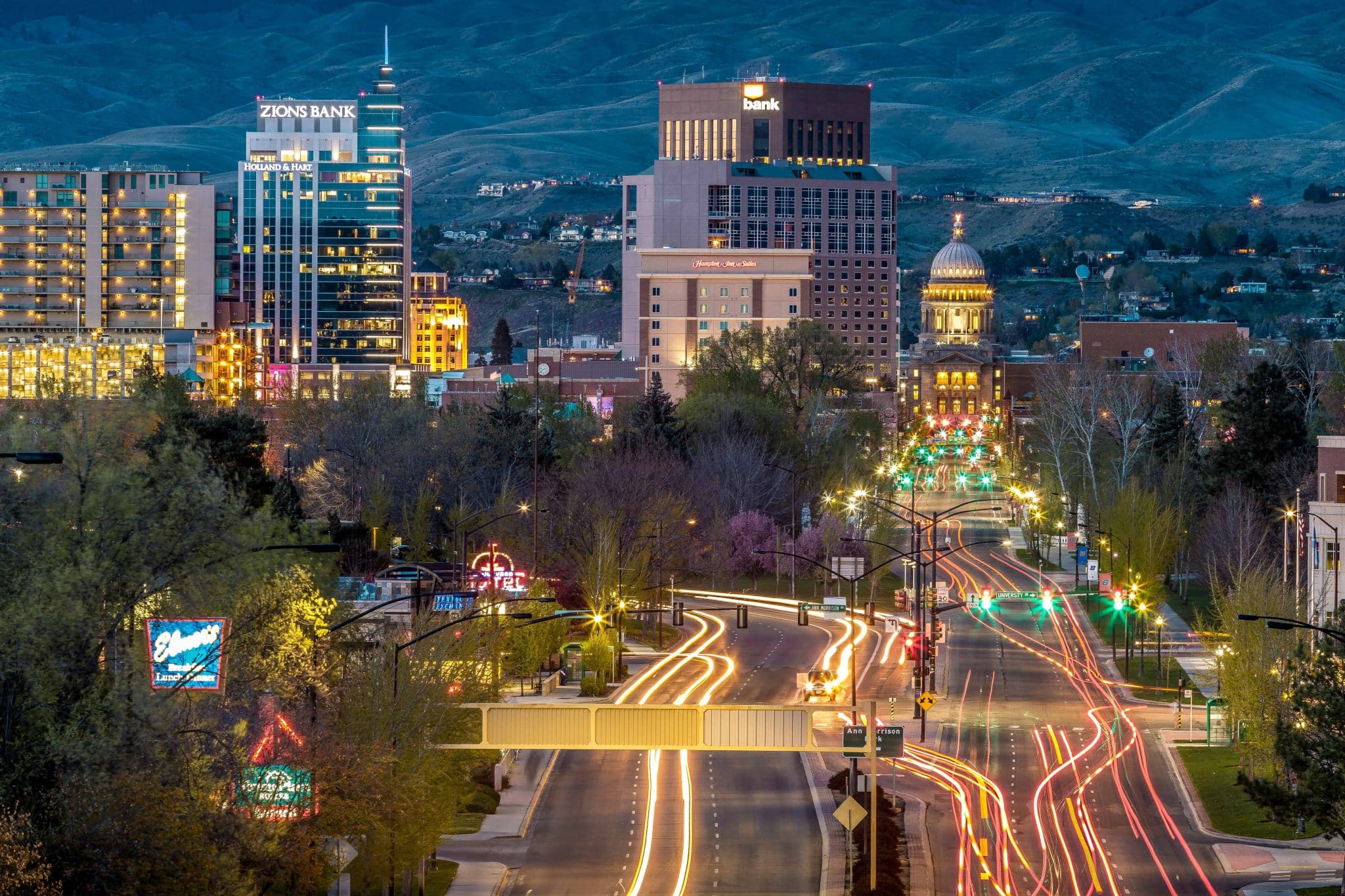 Boise city skyline at night with the State Capitol and foothills in the background, representing Assemble’s flagship location