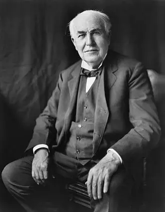 Thomas Edison portrait in The Edison Room. Vintage photo of the famous inventor in a suit and bow tie.