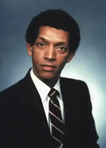 Carruthers Room Boise: Portrait of a man in a suit and tie, likely associated with the Carruthers Room.